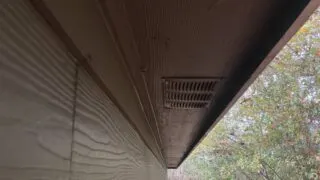 remove insulation from soffit vents.